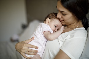 mother holding baby